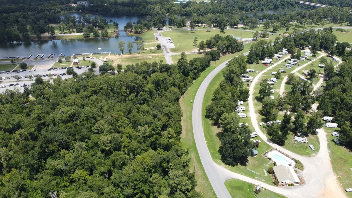 Aerial view of Flint River RV Park beside Earle May Boat Basin and the Flint River in Bainbridge, GA