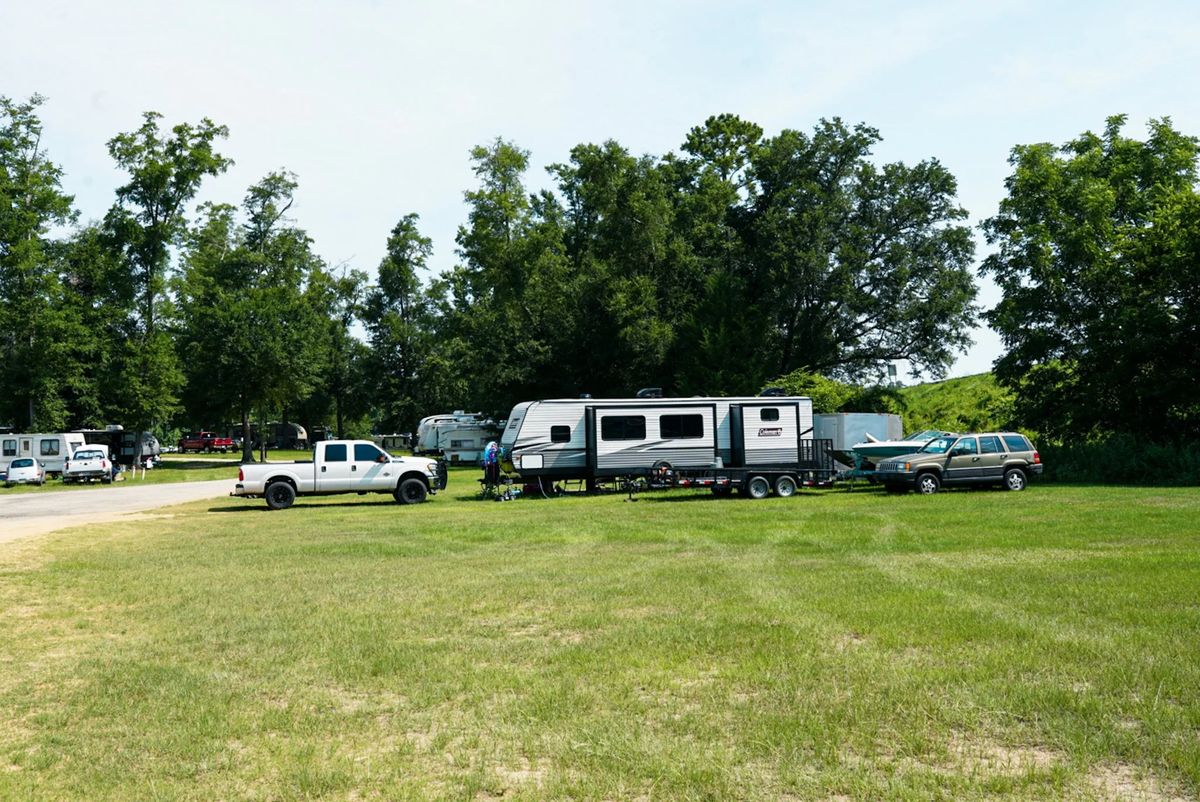 Open, grassy RV sites with room for trucks and trailers